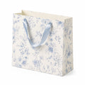 Sac cadeau 30 x 12 x 25 cm en papier blanc bleu à motif floral avec anses ruban